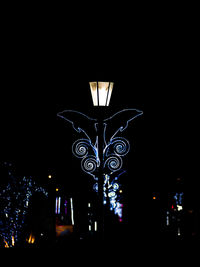 Low angle view of illuminated building at night