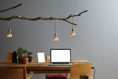 Illuminated lighting equipment hanging on table