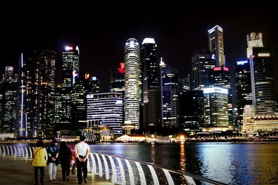 Illuminated modern buildings in city at night