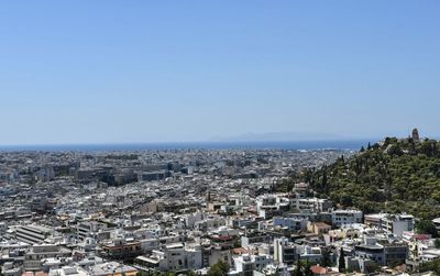 High angle view of townscape against clear blue sky