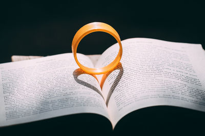 Close-up of heart shape on book