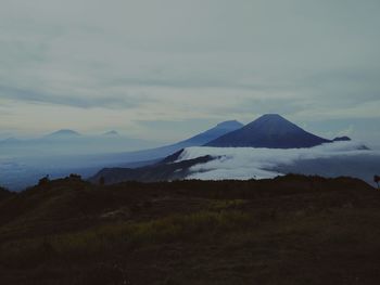 Scenic view of snowcapped mountains against sky