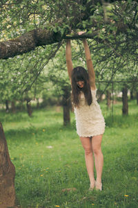 Full length of young woman in park