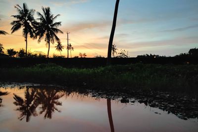 Scenic view of lake against sky during sunset