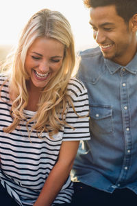 Couple sitting at building terrace