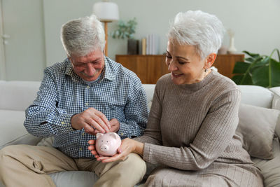 Portrait of senior man with teddy bear