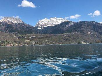 Scenic view of lake and mountains against sky