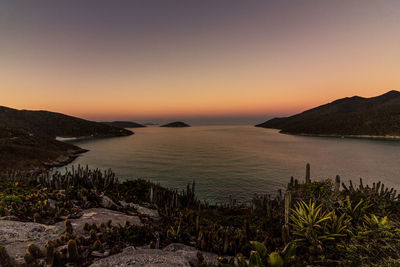 Scenic view of sea against clear sky during sunset