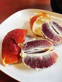 Close-up of fruits in plate on table