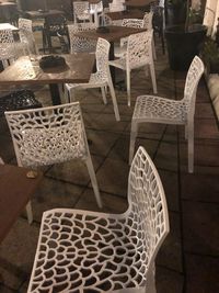 High angle view of chairs on table