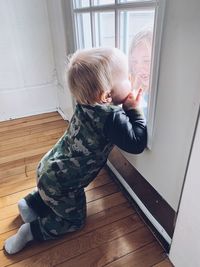 Rear view of boy at home