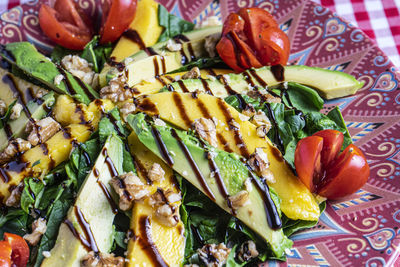 Close up of mango and avocado salad. feeding background