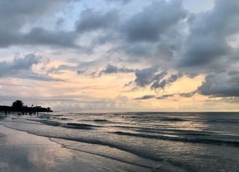 Scenic view of beach against sky during sunset