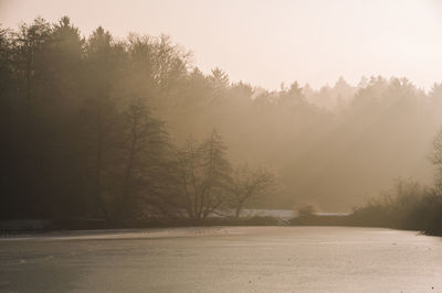 Scenic view of lake against sky during autumn