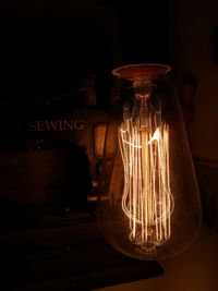 Close-up of illuminated light bulb