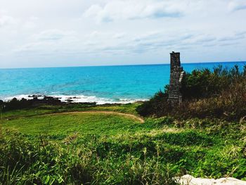 Scenic view of sea against cloudy sky