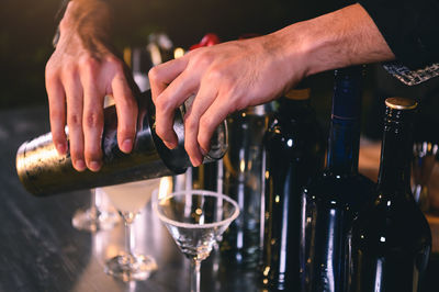 Close-up of bartender making drink