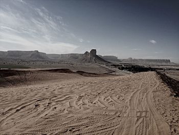 Scenic view of desert against sky