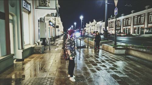 Blurred motion of man walking on city street