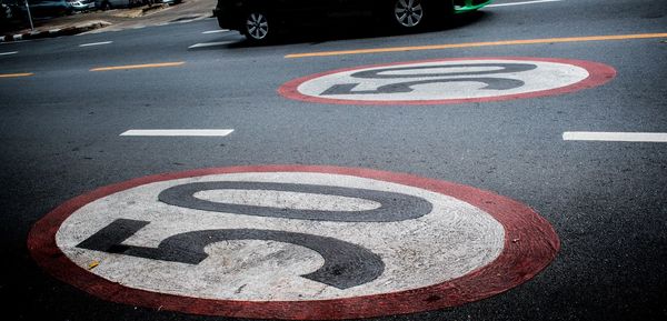 High angle view of bicycle sign on road