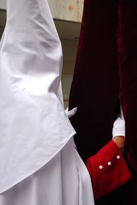 Rear view of man and woman standing in corridor