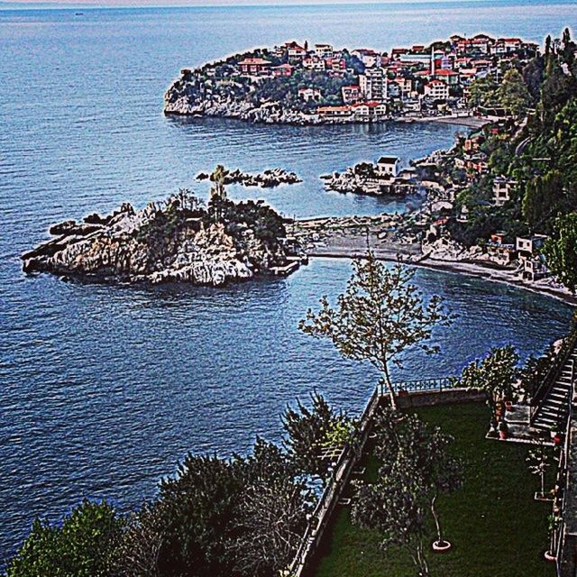 water, sea, nature, high angle view, tranquility, day, travel destinations, nautical vessel, tranquil scene, tree, outdoors, blue, built structure, tourism, rippled, travel, scenics, beauty in nature, plant, rock - object