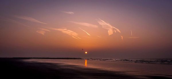 Scenic view of sea at sunset