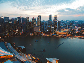 Aerial view of modern buildings in city against sky