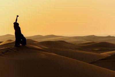 Man in desert at sunset