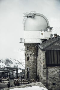 Building against sky in city during winter