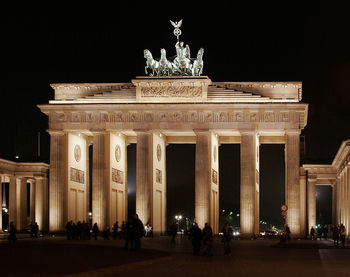 Crowd at brandenburg gate during night