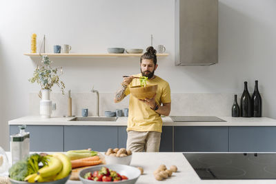 Young man preparing food at home