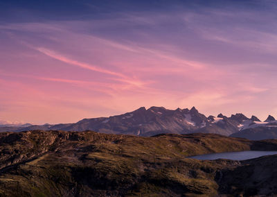 Scenic view of mountains against sky during sunset