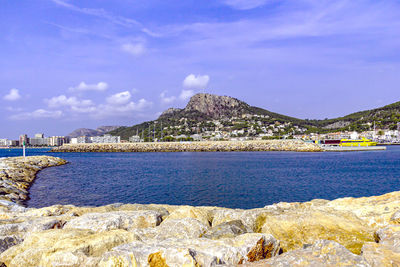 Image of rocky rocks forming a protective breakwater at marina entrance