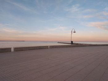 Scenic view of beach against sky during sunset