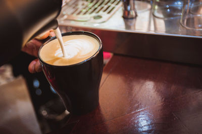 High angle view of cappuccino on table