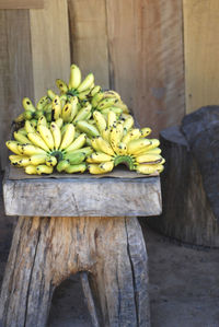 Bunch of bananas on wooden bench