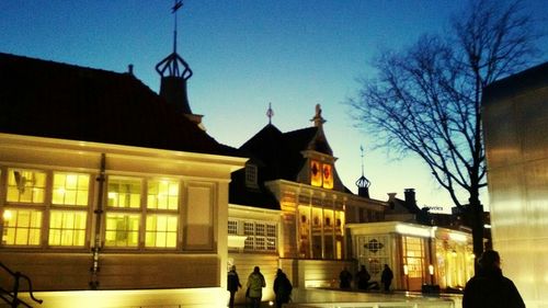 Illuminated buildings against sky