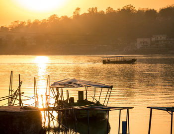 Scenic view of lake against sky during sunset