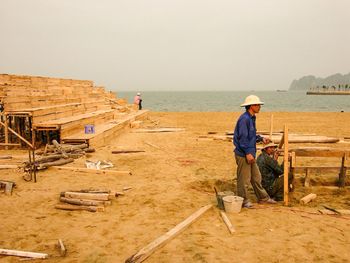 Full length of woman standing on beach