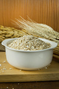 Close-up of bread in bowl on table at home