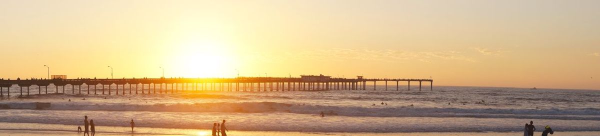 Scenic view of sea against clear sky during sunset