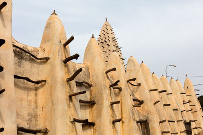 Exterior of grand mosque against sky