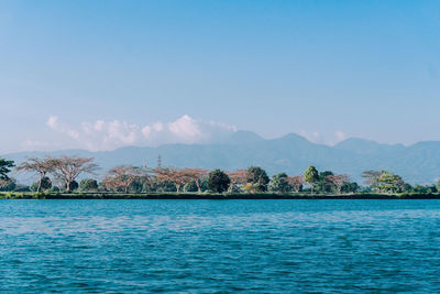 Scenic view of sea against blue sky