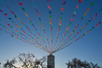 Pecked paper cascading from a clock tower in san jose del cabo