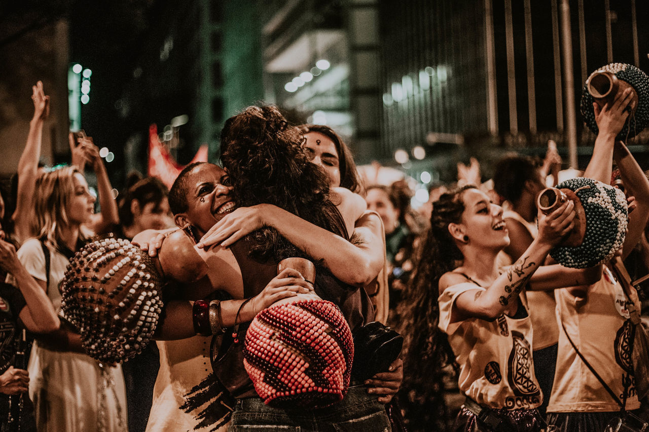 crowd, group of people, real people, large group of people, enjoyment, women, event, men, performance, music, arts culture and entertainment, adult, night, dancing, young women, audience, standing, young adult, togetherness, human arm, arms raised, popular music concert, nightlife, rock music, excitement, hand raised