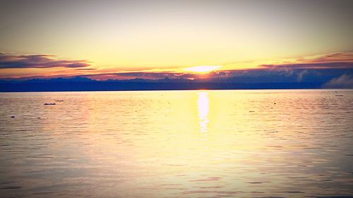 Scenic view of sea at sunset