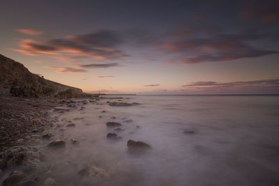 Scenic view of sea against sky during sunset