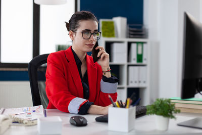 Young businesswoman working in office