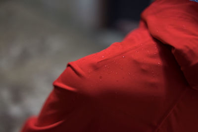 Close-up of red woman against blurred background